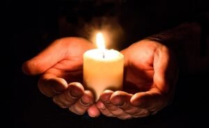 Troy Indivisible homepage christmas background, hands, open, candle, candlelight, prayer, pray, give, light, flame, open hands, darkness, hope, concept, idea